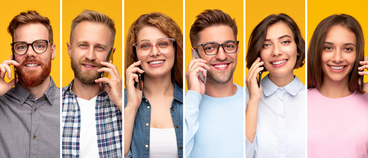 Happy young people talking on mobile phones.